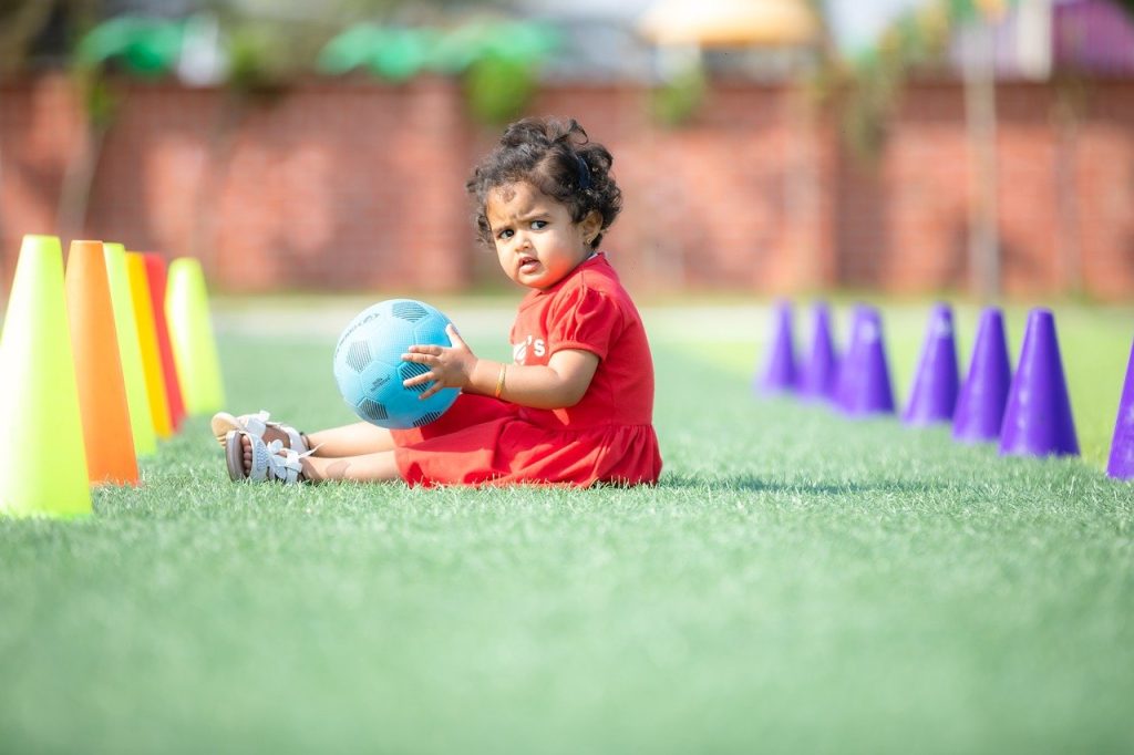 child girl playing ball game